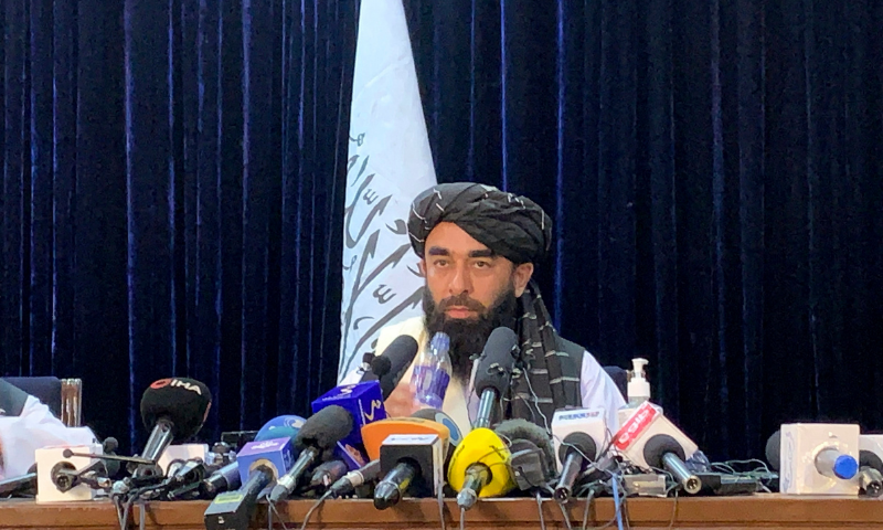 Taliban spokesman Zabihullah Mujahid speaks at the first Taliban news conference in Kabul