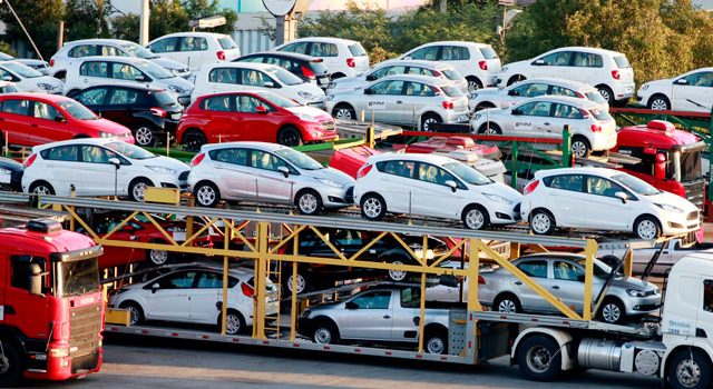 Imported cars being transported in Pakistan