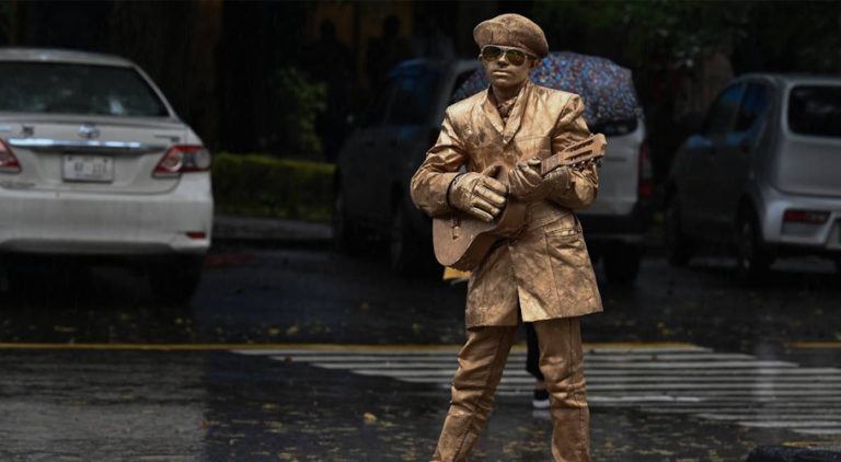 Walking Talking Golden Man Statue on streets of Islamabad
